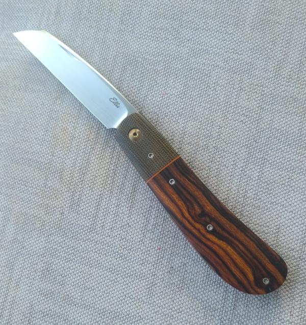 JD ELLIS swayback...ironwood scales..micarta bolsters...Rwl34..4" clsd...titanium hardware...swag JD ELLIS swayback...ironwood scales..micarta bolsters...Rwl34..4" clsd...titanium hardware...swag