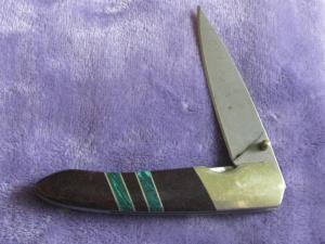 Sante Fe Line Lock Folder w/Rain Drop Damascus blade.