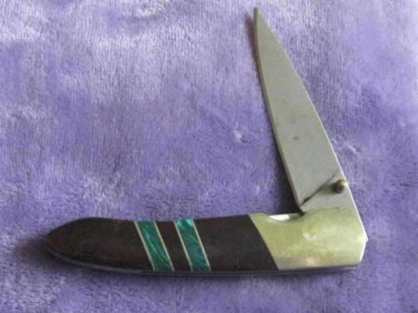 Sante Fe Line Lock Folder w/Rain Drop Damascus blade.