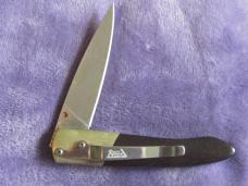 Sante Fe Line Lock Folder w/Rain Drop Damascus blade.