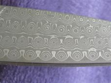 Sante Fe Line Lock Folder w/Rain Drop Damascus blade.