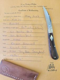 K'roo Desert Ironwood Swayback..Rwl34...3.75" closed...filework..fluted..red liners..coa and slip