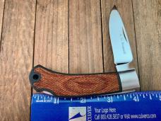 A.G. Russell Model 702M Lockback Seki Japan Pakkawood and Molded Nylon