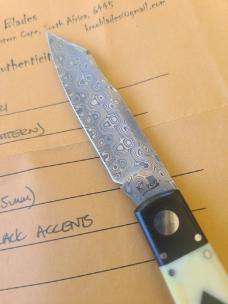  K'roo Native.. 4"..Black Linen bolsters&caps..Warthog Tusk Ivory Scales..red accents..Damasteel 