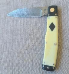  K'roo Native.. 4"..Black Linen bolsters&caps..Warthog Tusk Ivory Scales..red accents..Damasteel 