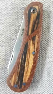 Johan Ellis Lion 4",Birch Burl inlays and Natural Micarta Frame over G10 and titanium..Rwl34..coa 