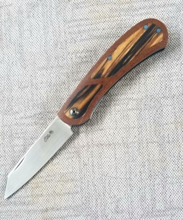 Johan Ellis Lion 4",Birch Burl inlays and Natural Micarta Frame over G10 and titanium..Rwl34..coa Johan Ellis Lion 4",Birch Burl inlays and Natural Micarta Frame over G10 and titanium..Rwl34..coa