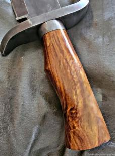 Burnished Stainless Steel Bowie knife with leather sheath.
