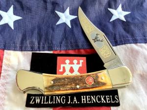 J A Henckels Large 5" Folding Hunter with Super Stag Handles in display. NOS and a beauty