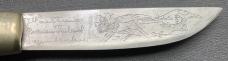Oss Ruutel fixed blade sheath knife made in Finland with wonderful etching on the blade. Light use. 