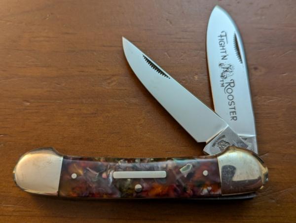 FIGHT'N ROOSTER 3 3/4" COPPERHEAD CANOE IN RARE PURPLE SWIRL CELLULOID 