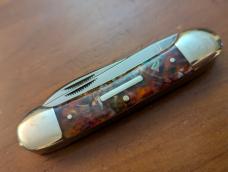 FIGHT'N ROOSTER 3 3/4" COPPERHEAD CANOE IN RARE PURPLE SWIRL CELLULOID 