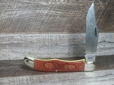 Schrade 125OT Mustang Folding Hunter with Red Linen Micarta Handles