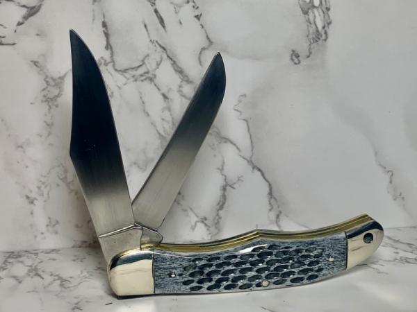 Schrade 25OT Folding Hunting Knife with Dyed, Jigged Bone Handles