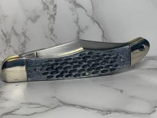 Schrade 25OT Folding Hunting Knife with Dyed, Jigged Bone Handles