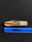 Ideal Products Inc Swing Guard Cheetah style Lockback Knife with Striped Scales