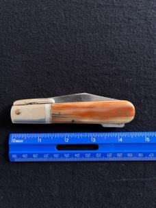 Ideal Products Inc Swing Guard Cheetah style Lockback Knife with Striped Scales