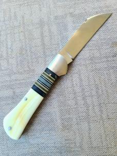 K'roo Warthog Tusk Striper Raven...Ivory Scales..Striper Bolsters..Rwl34...3.75 closed..coa and slip