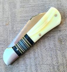 K'roo Warthog Tusk Striper Raven...Ivory Scales..Striper Bolsters..Rwl34...3.75 closed..coa and slip