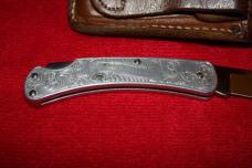 BUCK 110 FOLDING KNIFE WITH LEATHER SHEATH