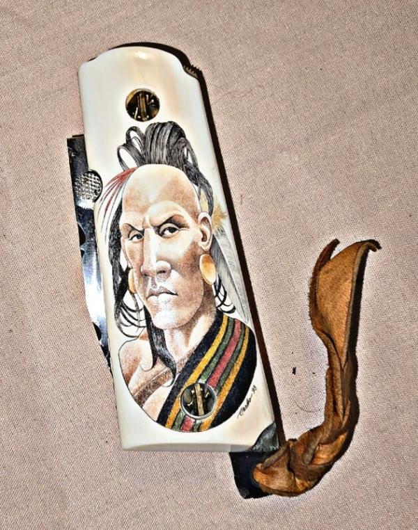 BASKETT Custom knife. Colt 45 grips with custom SCRIMSHAWED American Indian design on Mammoth tusk