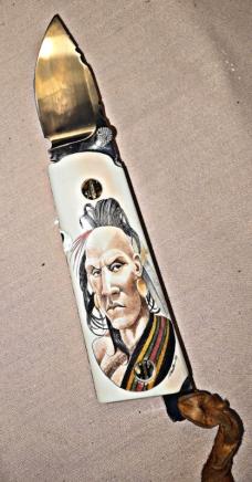 BASKETT Custom knife. Colt 45 grips with custom SCRIMSHAWED American Indian design on Mammoth tusk