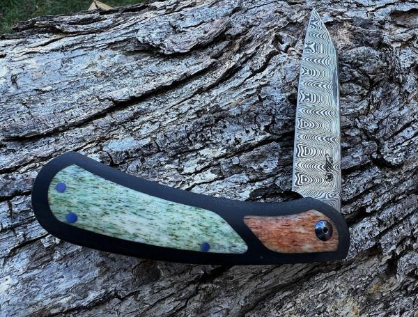 JOHAN ELLIS CUSTOM LION DAMASTEEL PAPER MICARTA FRAME WITH GIRAFFE INLAYS 