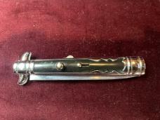 Vintage Hellraiser Spanish Stiletto automatic knife; black scales