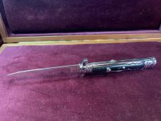 Vintage Hellraiser Spanish Stiletto automatic knife; black scales