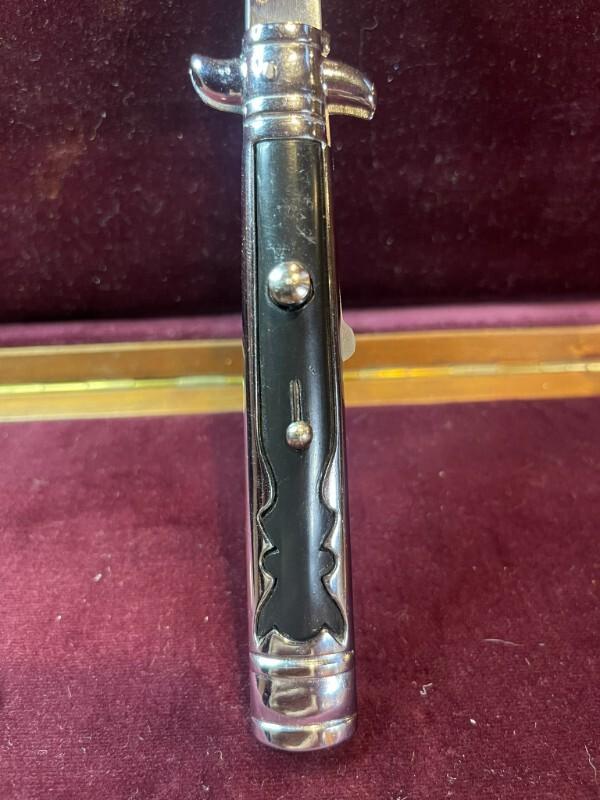 Vintage Hellraiser Spanish Stiletto automatic knife; black scales