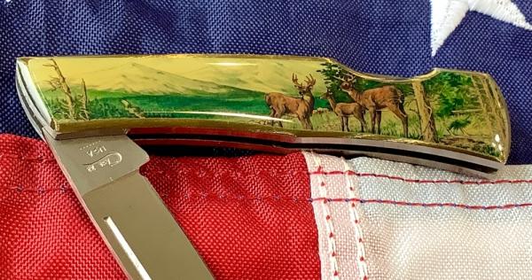 Case xx 1984 Medium Lockback (mdl# 059L SS) w/ Deer in wilderness theme Synthetic Handles -NOS Case xx 1984 Medium Lockback (mdl# 059L SS) w/ Deer in wilderness theme Synthetic Handles -NOS