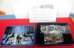AS NEW IN METAL DISPLAY PACK OF WOLVES' WILDLIFE FOLDING KNIFE AND MONEY CLIP