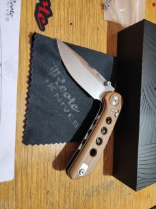 REATE PL-XT. Drop Point Blade. Tan G10 Handle. Quality crafted knife. Good weight very smoot