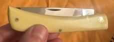 2005  CASE XX CLASSIC LARGE SOD BUSTER W/YELLOW HANDLES & CV BLADE. UNUSED & IN MINT CONDITION!