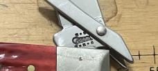 Case Cheetah, stainless steel, pocket worn red bone covers