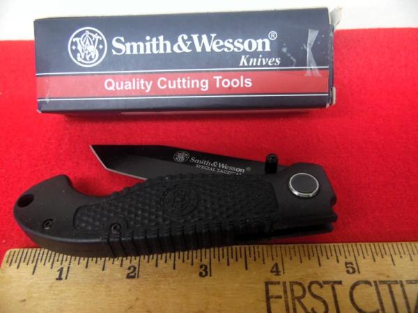 UNUSED FROM A FEW YEARS BACK IN BOX FLIP OPEN SMITH & WESSON TACTICAL 4-3/4" BLACK SCALES GOOD EDGE