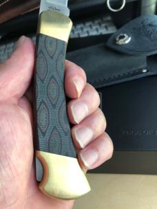 Buck 110 Folding Hunter with Magnacut Blade and Python Micarta Scales 