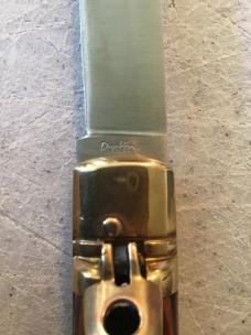24cm, 9 3/8in, birdshead, auto, brass, handle seem to be a colorful plywood