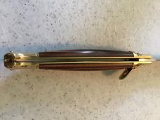 24cm, 9 3/8in, birdshead, auto, brass, handle seem to be a colorful plywood