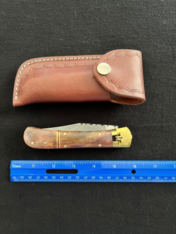 Lever Lock Automatic Knife w/ Red Bone Scales and Damascus Blade/File Work/Leather Sheath Lever Lock Automatic Knife w/ Red Bone Scales and Damascus Blade/File Work/Leather Sheath