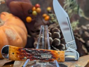 Case 1998 61549 L SS Copperlock with I believe is chestnut standard jigged bone handles. 