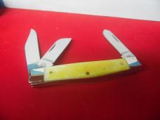 CASE XX 2014 USA YELLOW STOCKMAN "HE IS RISEN" IN TIN IS UNUSED