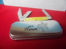 CASE XX 2014 USA YELLOW STOCKMAN "HE IS RISEN" IN TIN IS UNUSED