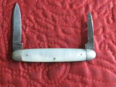 Tiny ULSTER 2 blade pen knife with pearl scales. Lightly sharpened.