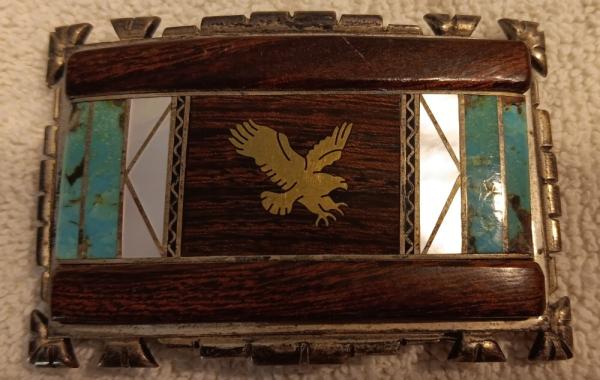 Dave (David) Yellowhorse Sterling Belt buckle with Ironwood, turquoise and mother of pearl inlay.