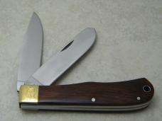 Remington USA R1128 2007 25th Anniv. Cocobola Silver Bullet Trapper Knife in Tin