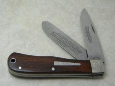 Remington USA R1128 2007 25th Anniv. Cocobola Silver Bullet Trapper Knife in Tin