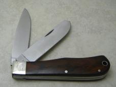 Remington USA R1128 2007 25th Anniv. Cocobola Silver Bullet Trapper Knife in Tin