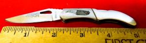CROCKETT STAINLESS KNIFE WITH EAGLE ON FRONT SIDE PRE OWNED NEVER USED