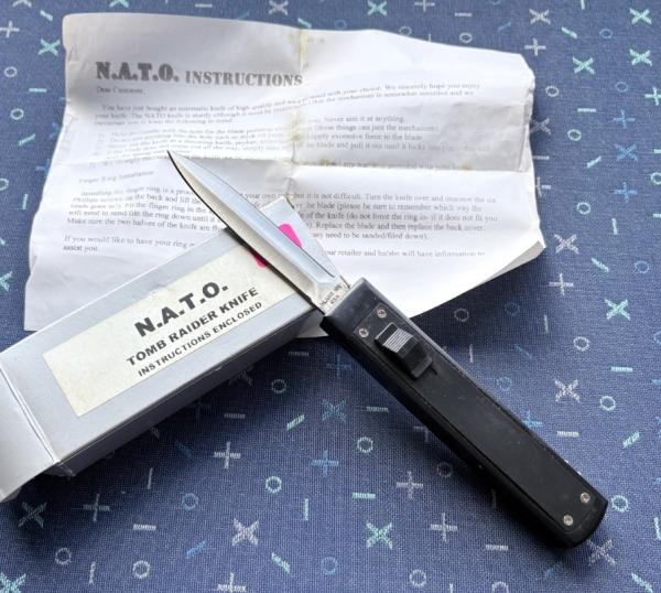Tomb Raider Out The Front (OTF) Switchblade Knife With Original Box And Paper, Unused Tomb Raider Out The Front (OTF) Switchblade Knife With Original Box And Paper, Unused